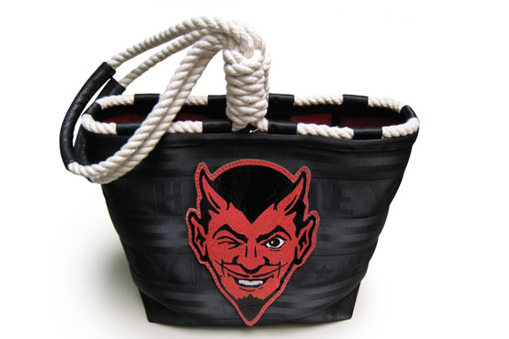 basket with a devil on the front and rope attached
