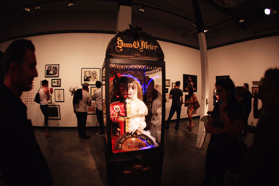 patrons in the art gallery, fortune teller in a box, dimly lit gallery