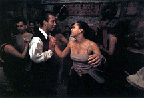 Photo of two figures dancing, "Americanos: Latino Life in the United States"