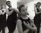 Black and white photo of girls in dance class, "Americanos: Latino Life in the United States"