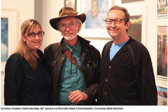 Three figures smiling for a picture