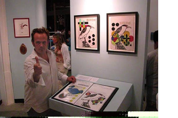 Man with thumbs up in the middle of gallery