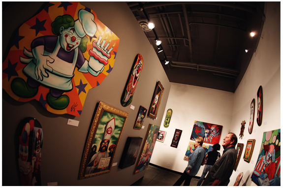 A photo of clown paintings/illustrations in gallery