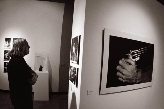 Man looks at installation images.