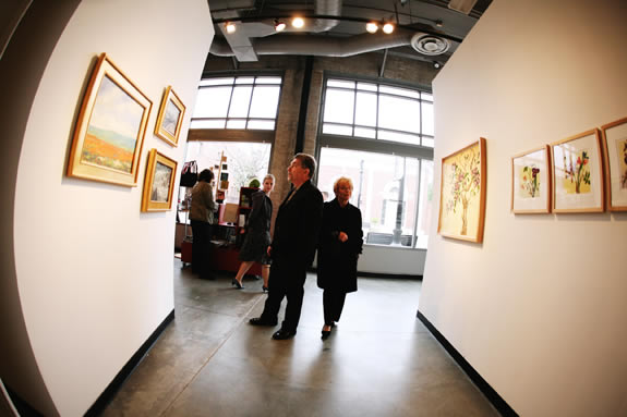 wide angle of paintings and people