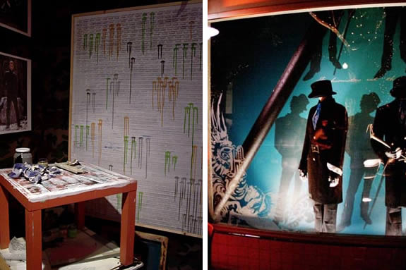 Installation shots. On the left is a a table with a poster behind. On the right are multiple dark figures