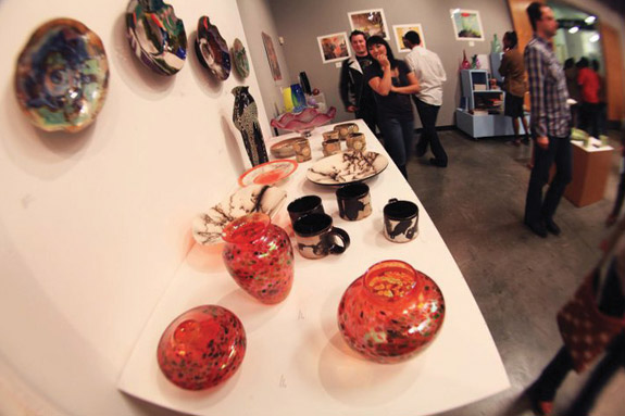 Ceramics and glass objects hanging and shelved.