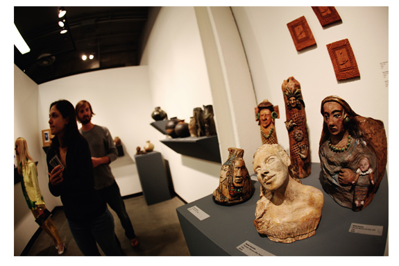 Five ceramic bust sculptures.