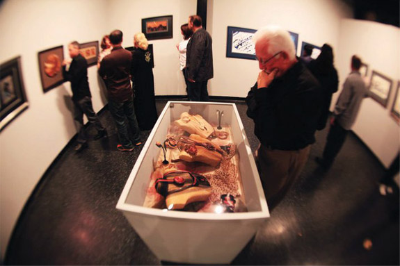 A man admiring a necklace display.