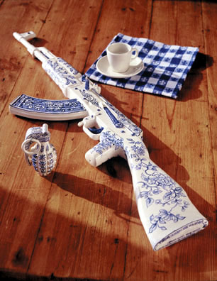 Charles Krafft. Porcelain gun and grenade painted with dark blue details.