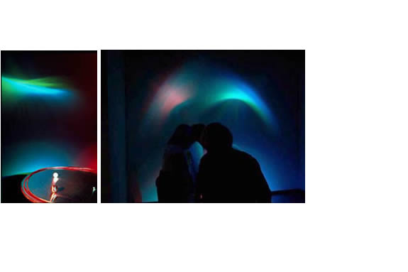 Dark room with colorful dim light projection.