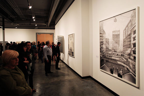 Patrons viewing works in the gallery