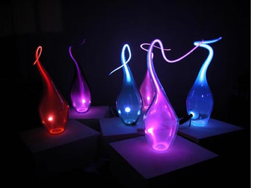 Wispy glass sculptures with neon lights in them.