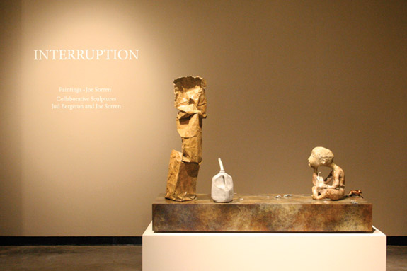 sculptures on pedestal