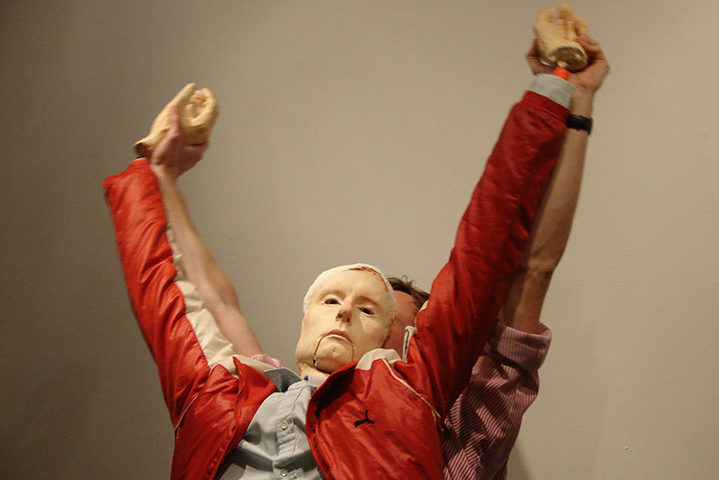 Zach Kleyn holding up a doll