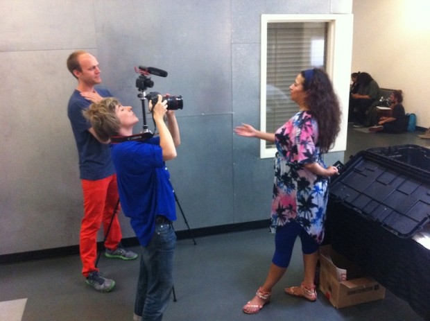 Daniel Tucker interviewing someone for his documentary, while another person films
