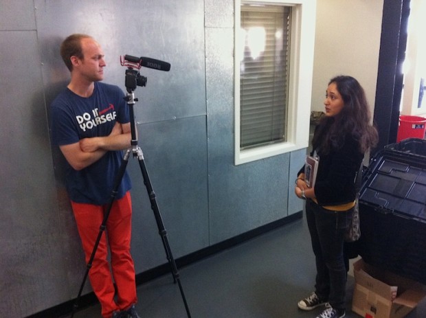 Daniel Tucker interviewing woman.