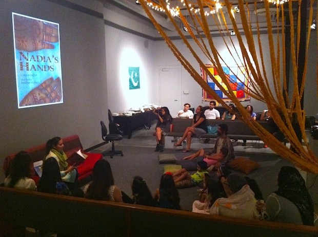 A group of people looking at a projection of "Nadia