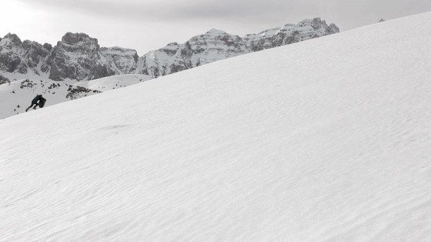 From video "Polaris" depicting person climbing a snowy mountain