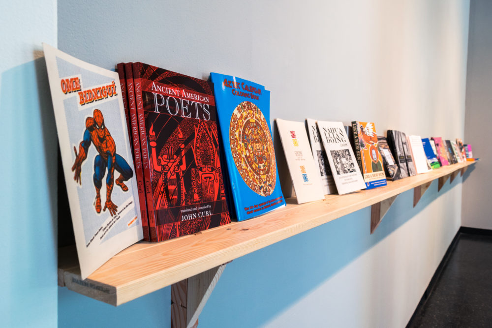 A shelf with books lined up