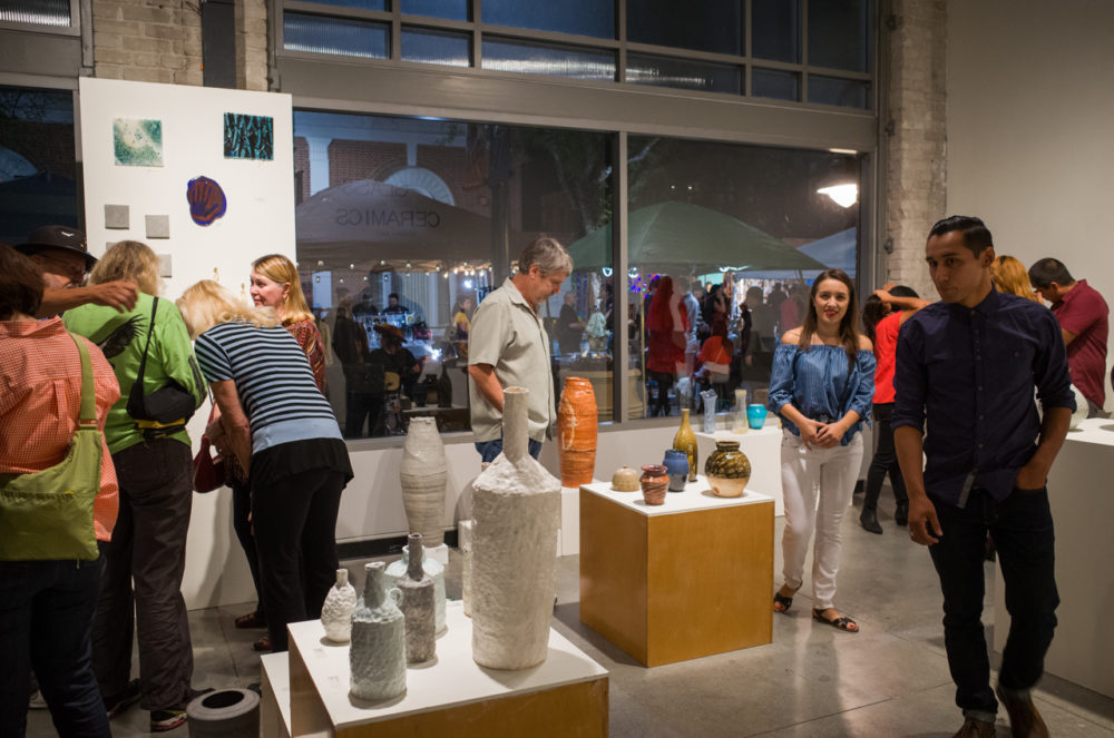 Patrons looking at the Glass and Ceramics show