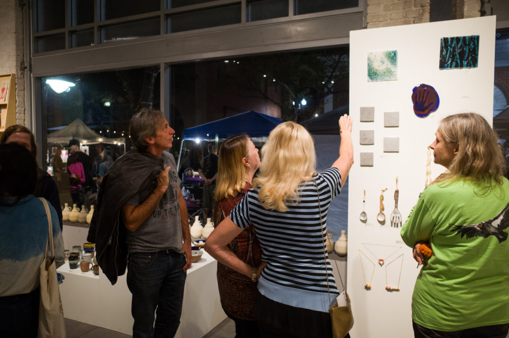 Patrons looking at the Glass and Ceramics show