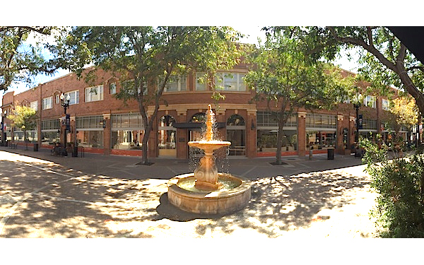 Promenade with building and fountain 