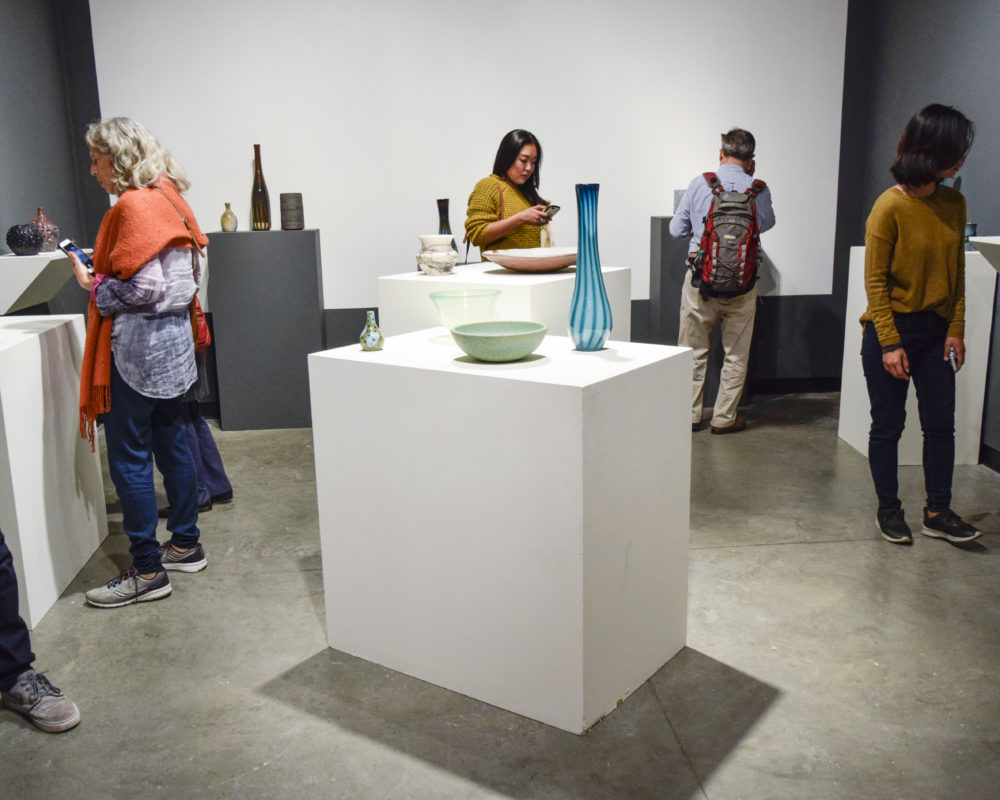 GLASS AND CERAMIC GALLERY FILLED WITH GUESTS