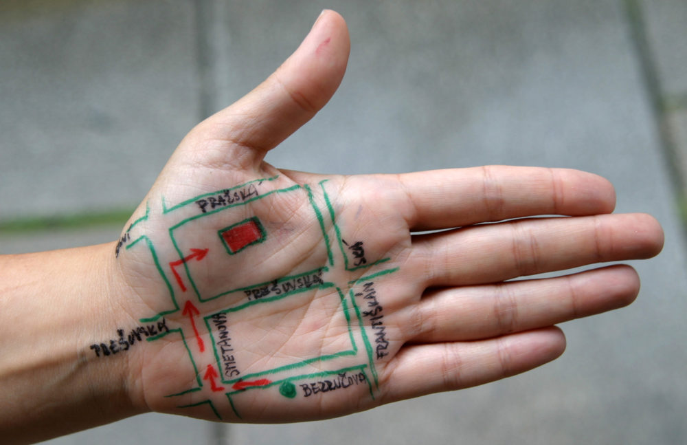 the palm of a hand with a map drawn on