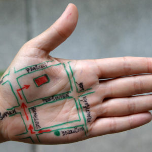 the palm of a hand with a map drawn on
