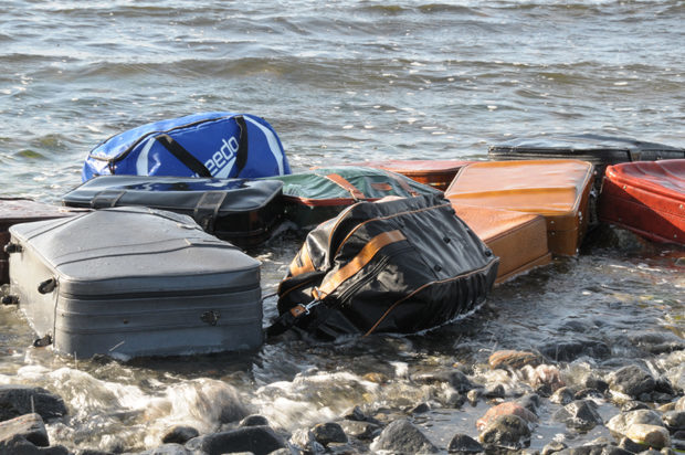 Suitcases floating in the ocean.