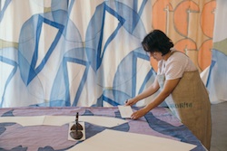 A woman artist dying fabric