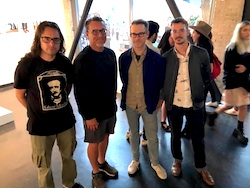 Artist Chris Kallmyer with three individuals