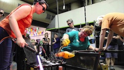 A group of people interacting with artifacts