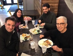 Artist Pablo Helguera having dinner with other local artists.