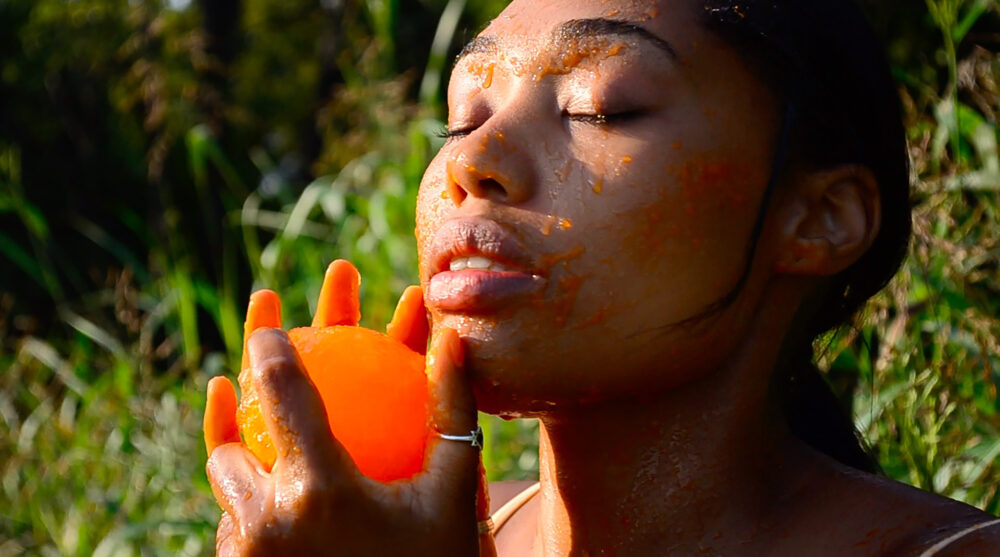 Woman rubbing a peeled on her face