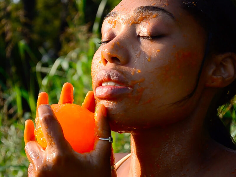 Woman rubbing a peeled on her face